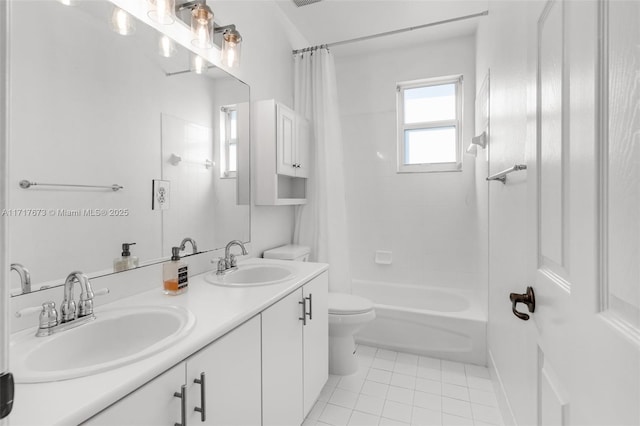 full bathroom with tile patterned floors, shower / bath combo, toilet, and vanity