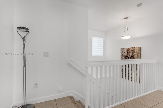 staircase featuring tile patterned floors