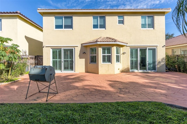 back of property featuring a patio