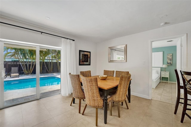 dining space with light tile patterned flooring