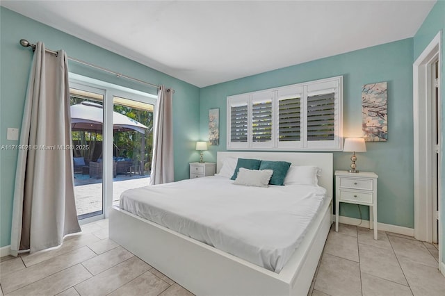 bedroom featuring access to exterior and light tile patterned floors