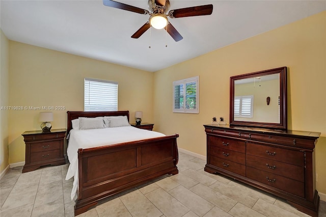 tiled bedroom with ceiling fan