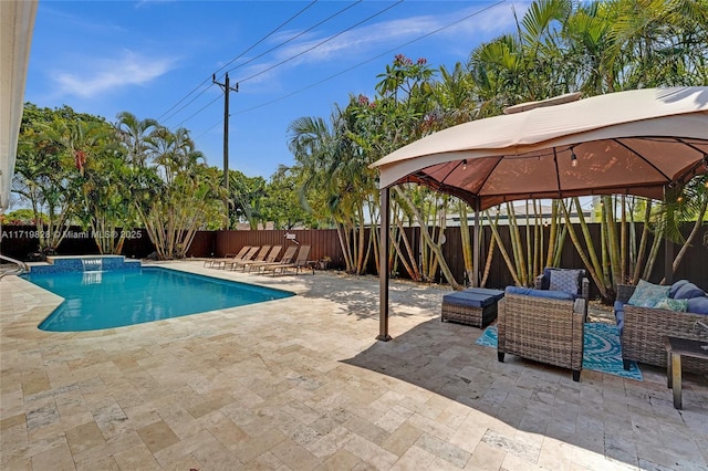 view of pool with an outdoor living space, a gazebo, and a patio area