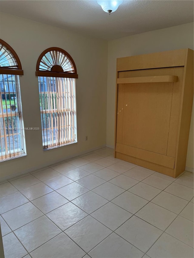 view of tiled spare room