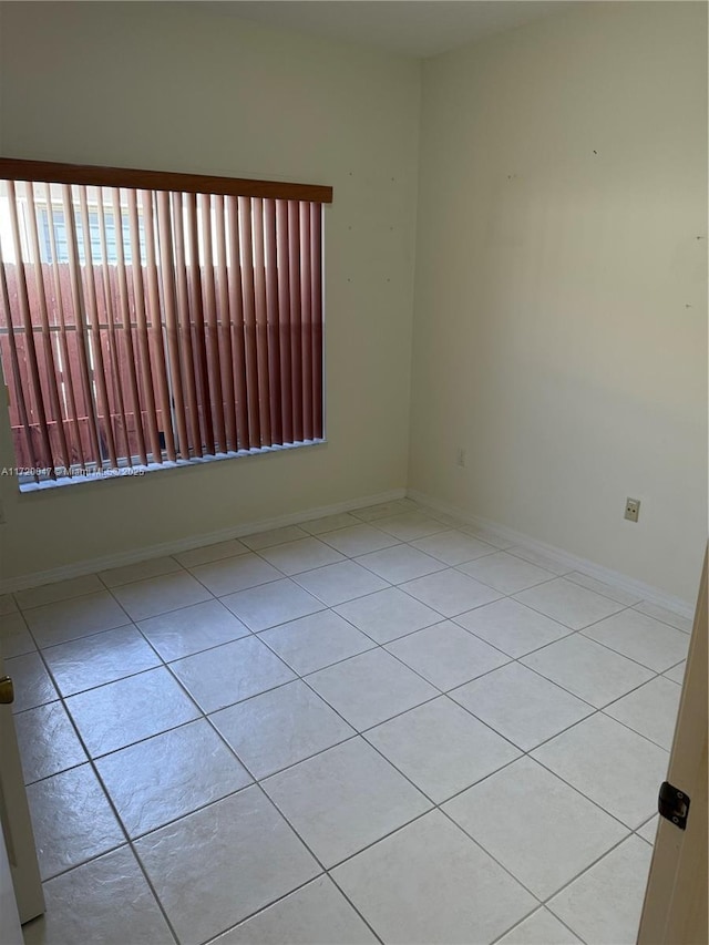 empty room featuring light tile patterned flooring