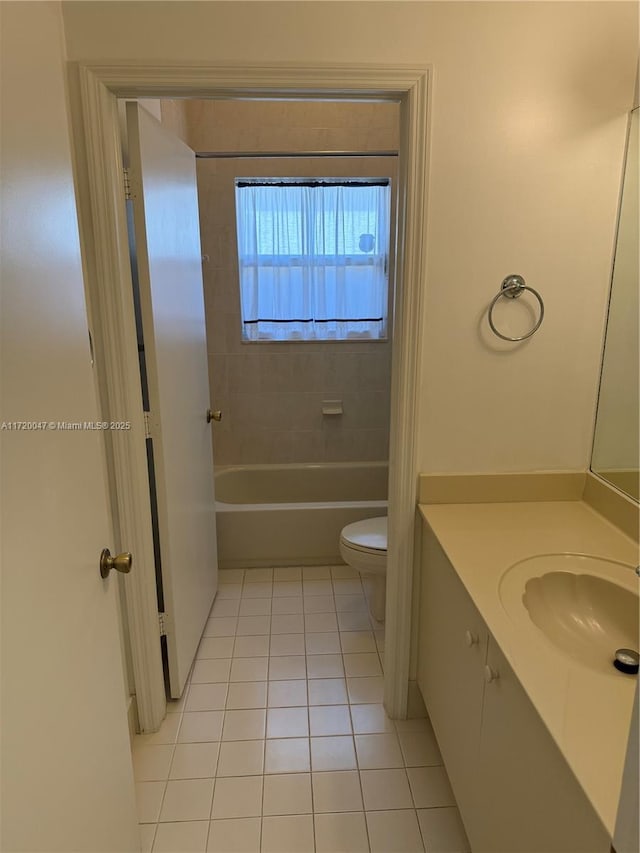 bathroom with tile patterned floors, vanity, and toilet