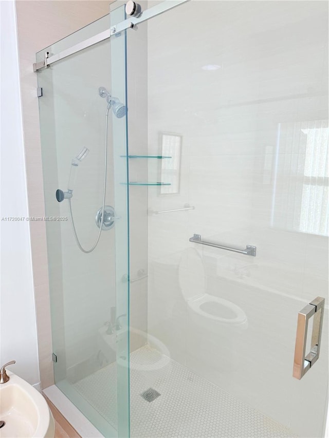 bathroom featuring walk in shower, a bidet, and sink