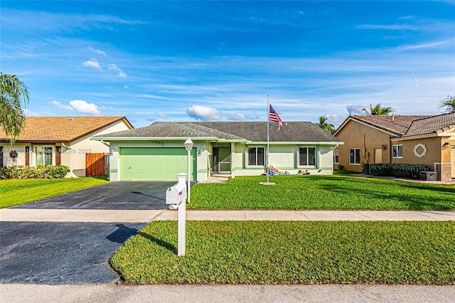 ranch-style house with a garage and a front lawn