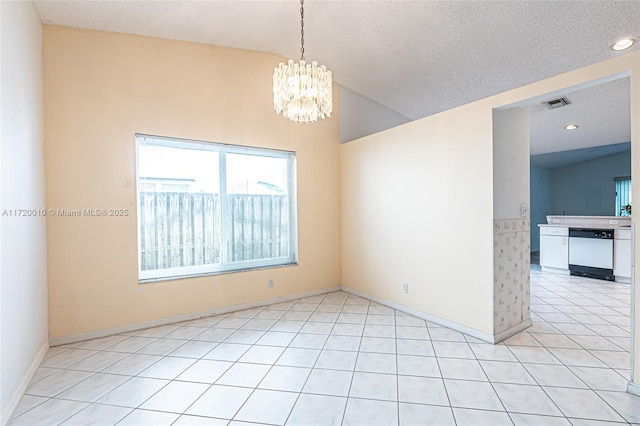 unfurnished room with a textured ceiling, an inviting chandelier, and lofted ceiling