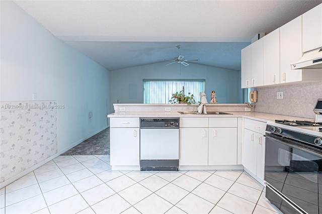 kitchen with gas range, dishwasher, kitchen peninsula, vaulted ceiling, and white cabinets