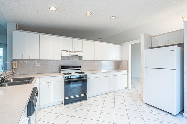 kitchen featuring white cabinetry, sink, white fridge, and range with gas stovetop