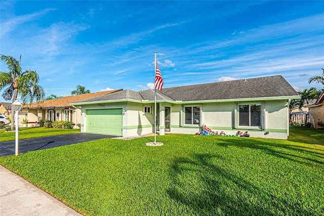 ranch-style home with a garage and a front lawn