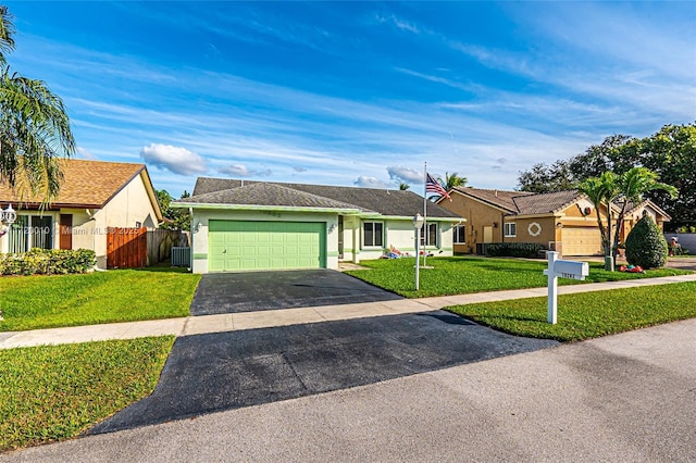 ranch-style home with a front lawn and a garage