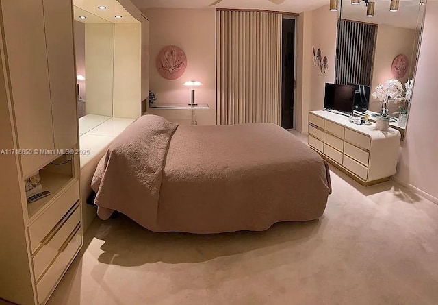 bedroom with light colored carpet