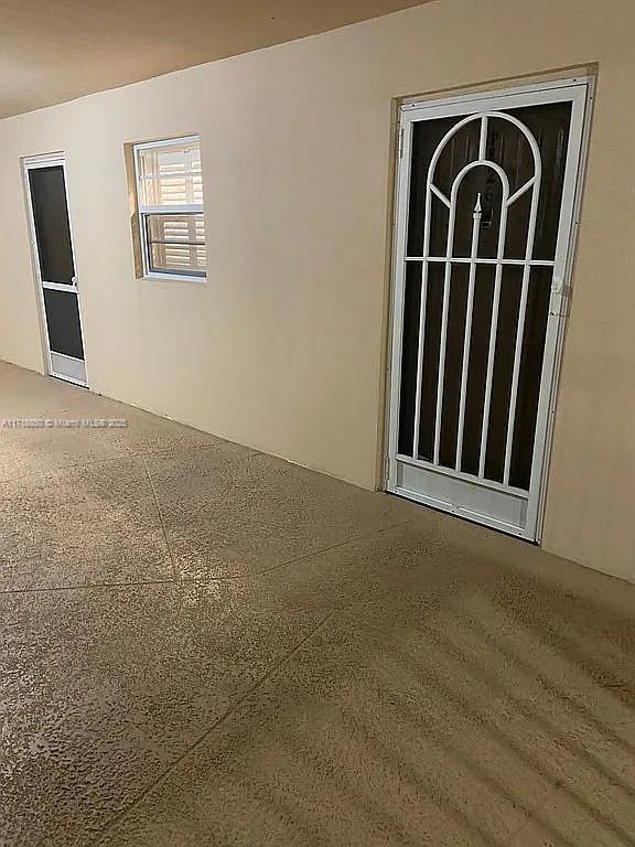 doorway to property with a patio area