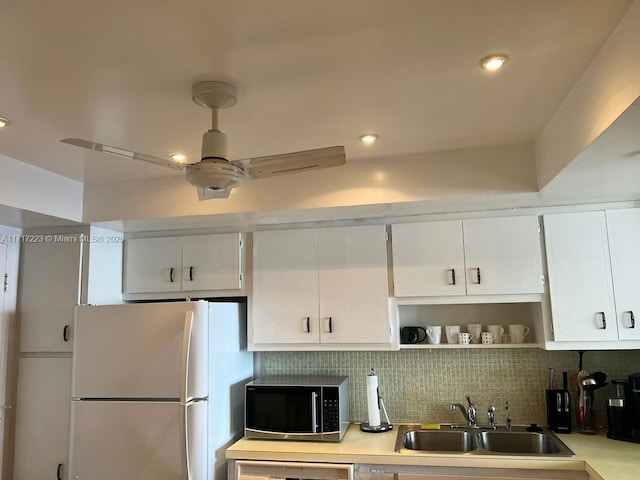1301 NE Miami Gardens Dr Unit 1024W, Miami, FL 33179 - kitchen with freestanding refrigerator, a sink, light countertops, white cabinetry, and open shelves