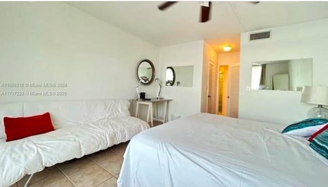 bedroom featuring tile patterned flooring and ceiling fan