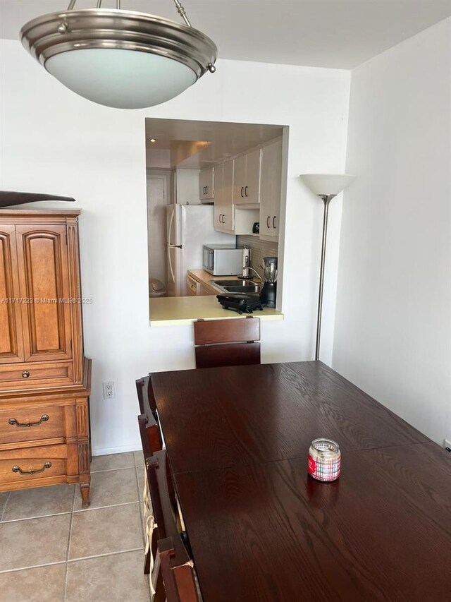 1301 NE Miami Gardens Dr Unit 1024W, Miami, FL 33179 - dining area featuring light tile patterned floors