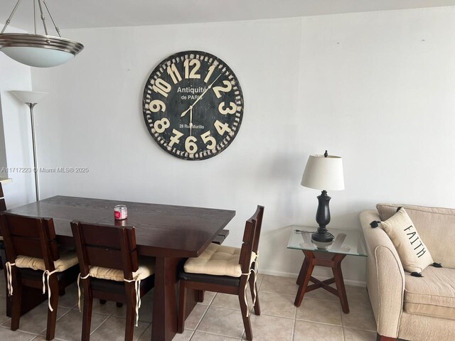 1301 NE Miami Gardens Dr Unit 1024W, Miami, FL 33179 - dining room with light tile patterned floors and baseboards