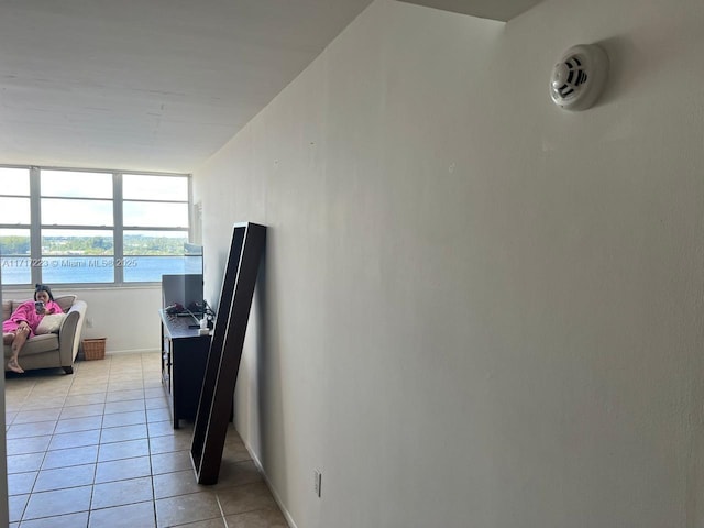 1301 NE Miami Gardens Dr Unit 1024W, Miami, FL 33179 - interior space featuring baseboards, light tile patterned floors, and a desk