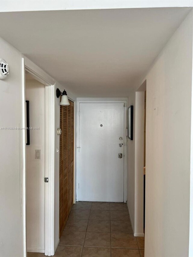 1301 NE Miami Gardens Dr Unit 1024W, Miami, FL 33179 - hallway with light tile patterned floors