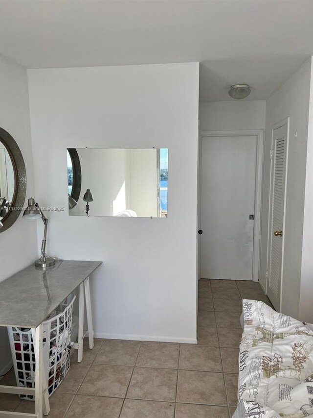 1301 NE Miami Gardens Dr Unit 1024W, Miami, FL 33179 - corridor featuring light tile patterned floors