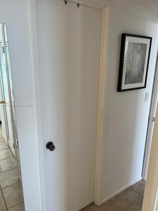 1301 NE Miami Gardens Dr Unit 1024W, Miami, FL 33179 - hall with baseboards and light tile patterned floors