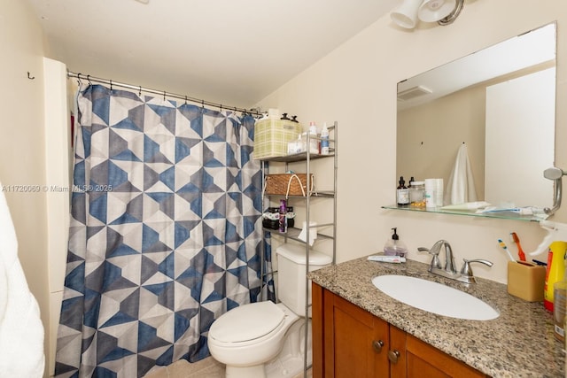 bathroom with vanity, toilet, and curtained shower