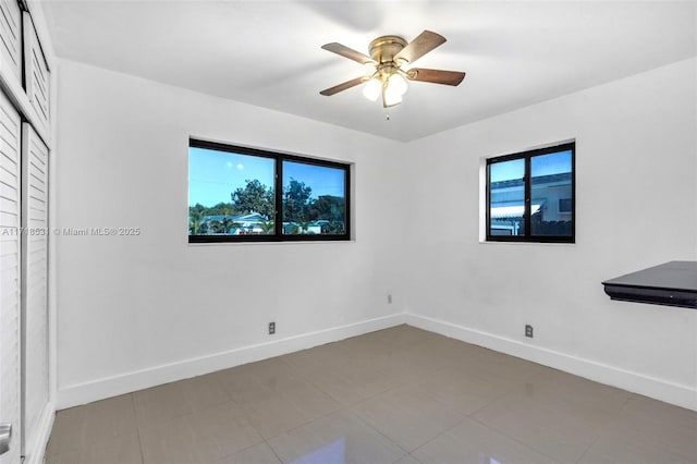 unfurnished room with ceiling fan