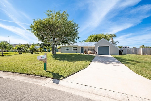 ranch-style home featuring a front lawn and a garage