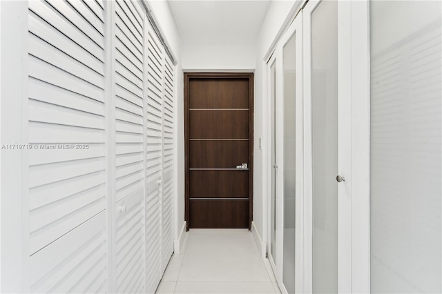 hall with light tile patterned flooring