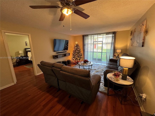 living room featuring floor to ceiling windows, a textured ceiling, ceiling fan, and dark wood-type flooring