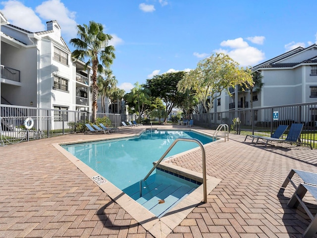 view of swimming pool with a patio area