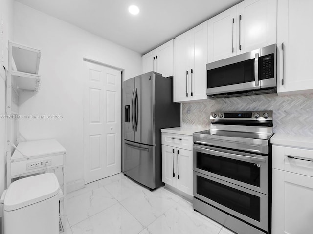 kitchen featuring white cabinetry and appliances with stainless steel finishes