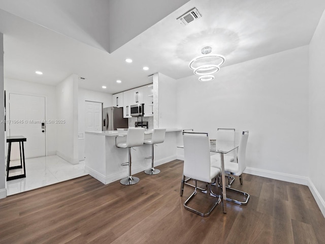 dining room featuring hardwood / wood-style flooring