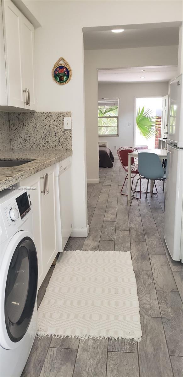 washroom featuring washer / clothes dryer