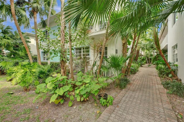 view of side of home featuring a balcony