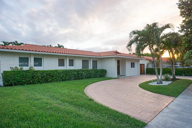 view of front of house with a yard