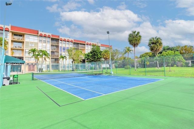 view of tennis court with basketball court