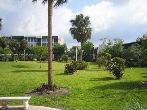 view of home's community with a lawn