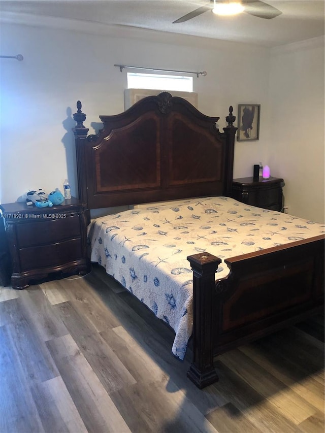 bedroom with hardwood / wood-style floors and ceiling fan