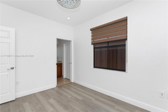 unfurnished room featuring light hardwood / wood-style flooring