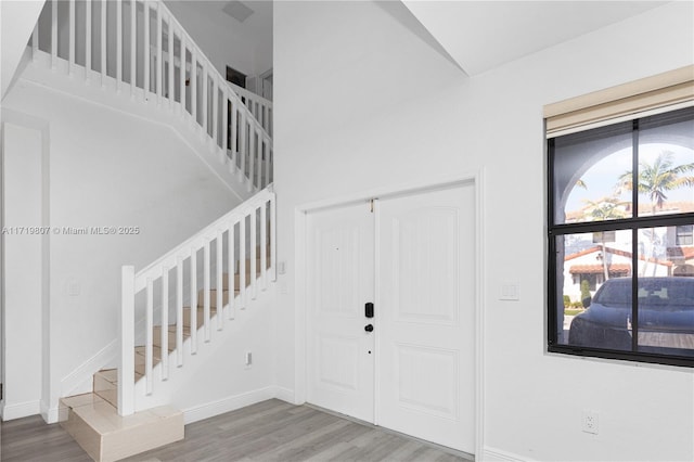 foyer entrance featuring hardwood / wood-style floors