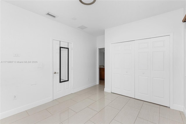 unfurnished bedroom featuring light tile patterned floors