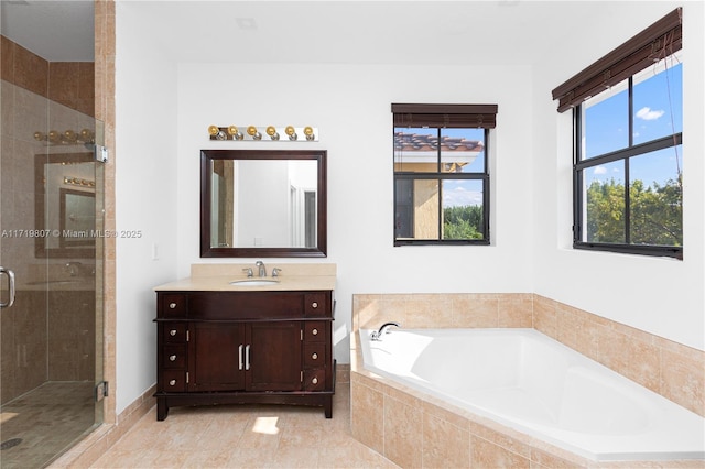 bathroom with tile patterned floors, vanity, and separate shower and tub