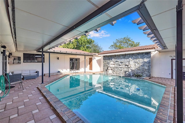 view of swimming pool featuring a patio