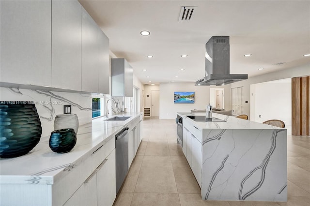 kitchen featuring island exhaust hood, sink, dishwasher, white cabinets, and a large island