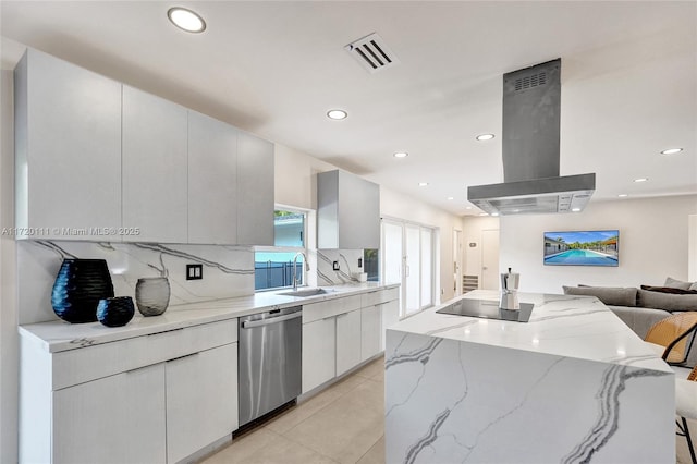 kitchen featuring sink, a breakfast bar area, stainless steel dishwasher, island exhaust hood, and white cabinets