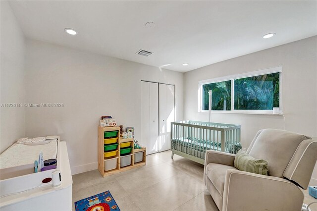 bedroom featuring a crib