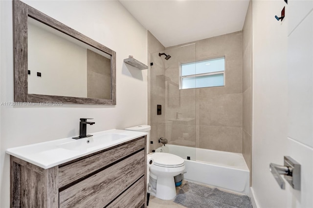 full bathroom featuring vanity, toilet, and tiled shower / bath